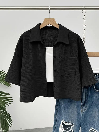 Cropped blouse worn